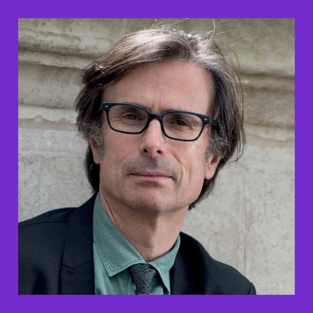 Speakers for schools founder robert Peston looking directly at the camera wearing a suit.